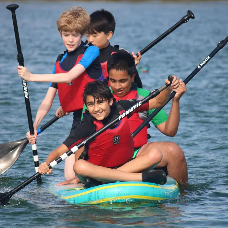 students on a paddle boat